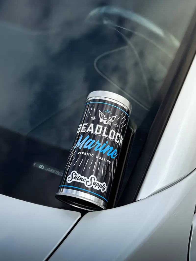 Professional ceramic coating product on a freshly prepped hood