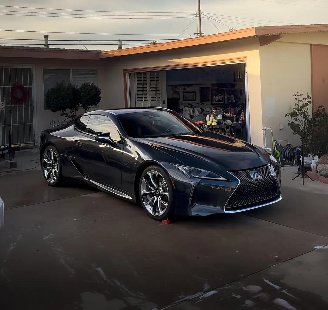 A freshly detailed Lexus LC 500 in a Ventura County driveway at dusk
