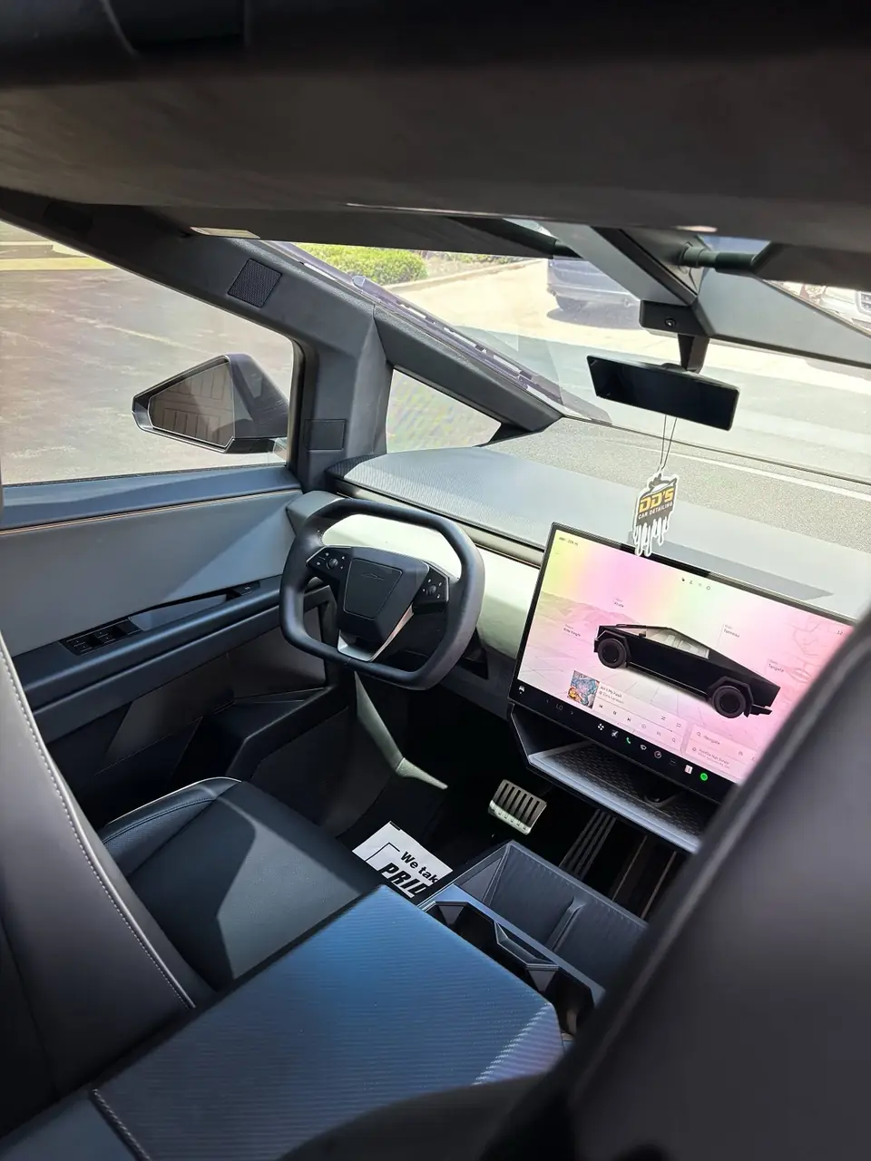 Spotless Cybertruck interior with DD's air freshener on the mirror