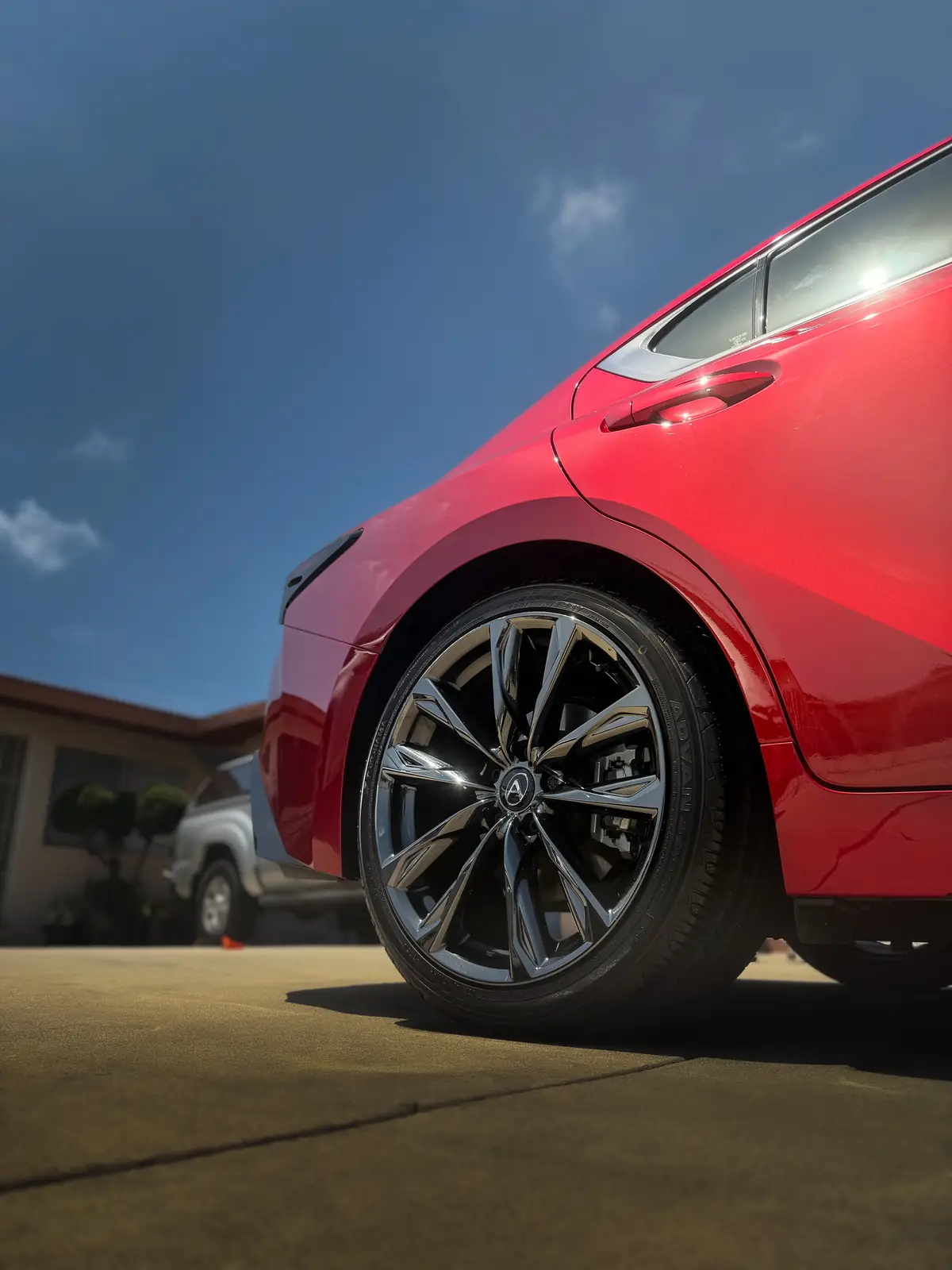 Deep gloss on the rear quarter of a ceramic-coated red Lexus
